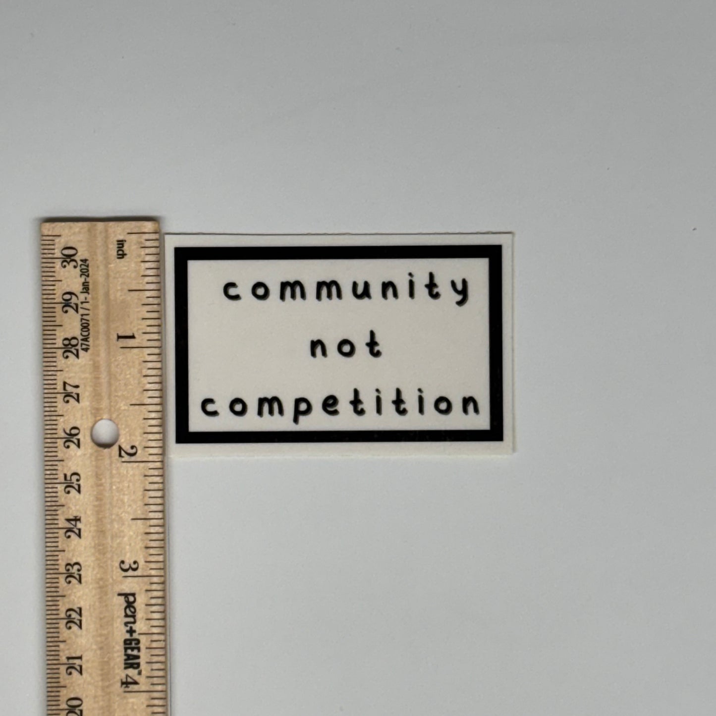 community not competition sticker
