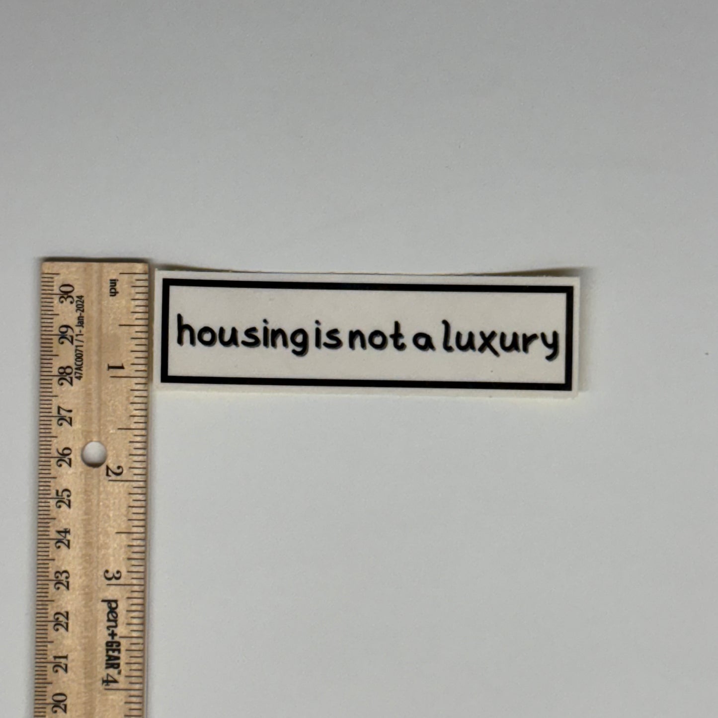 housing is not a luxury sticker