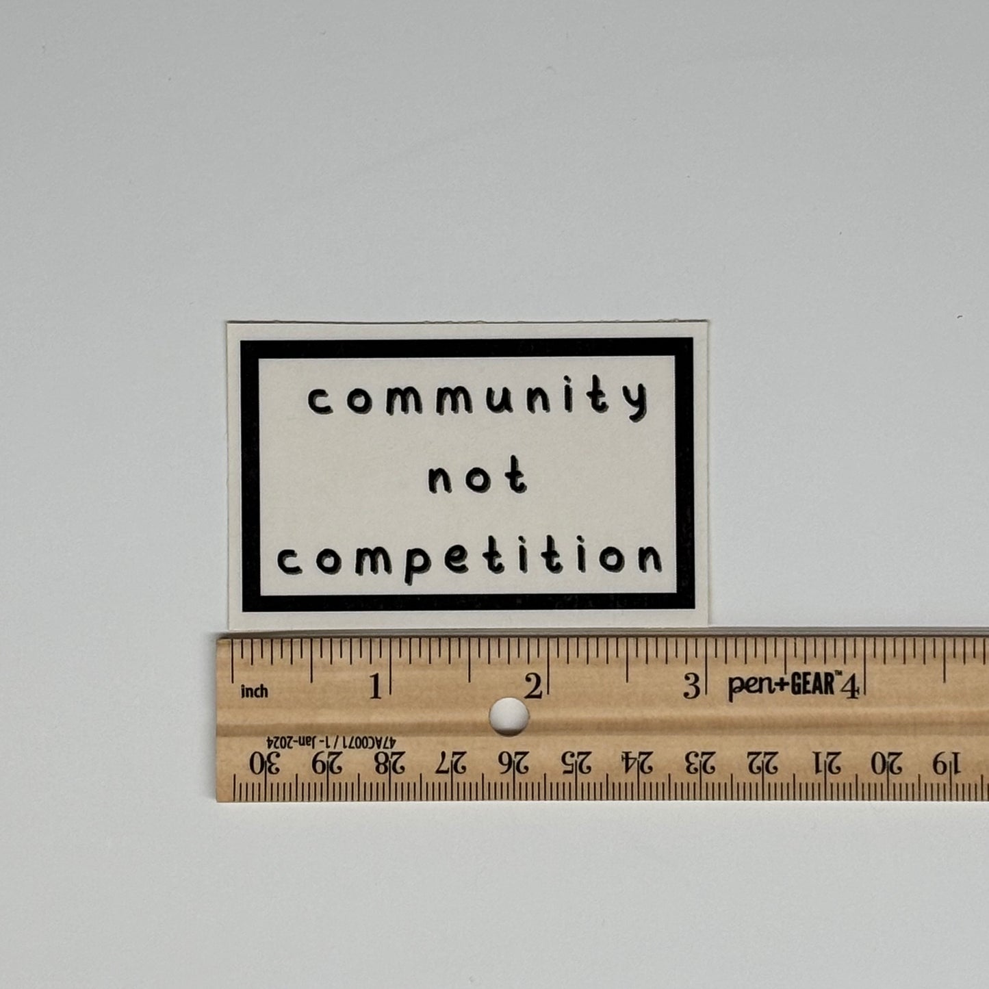 community not competition sticker