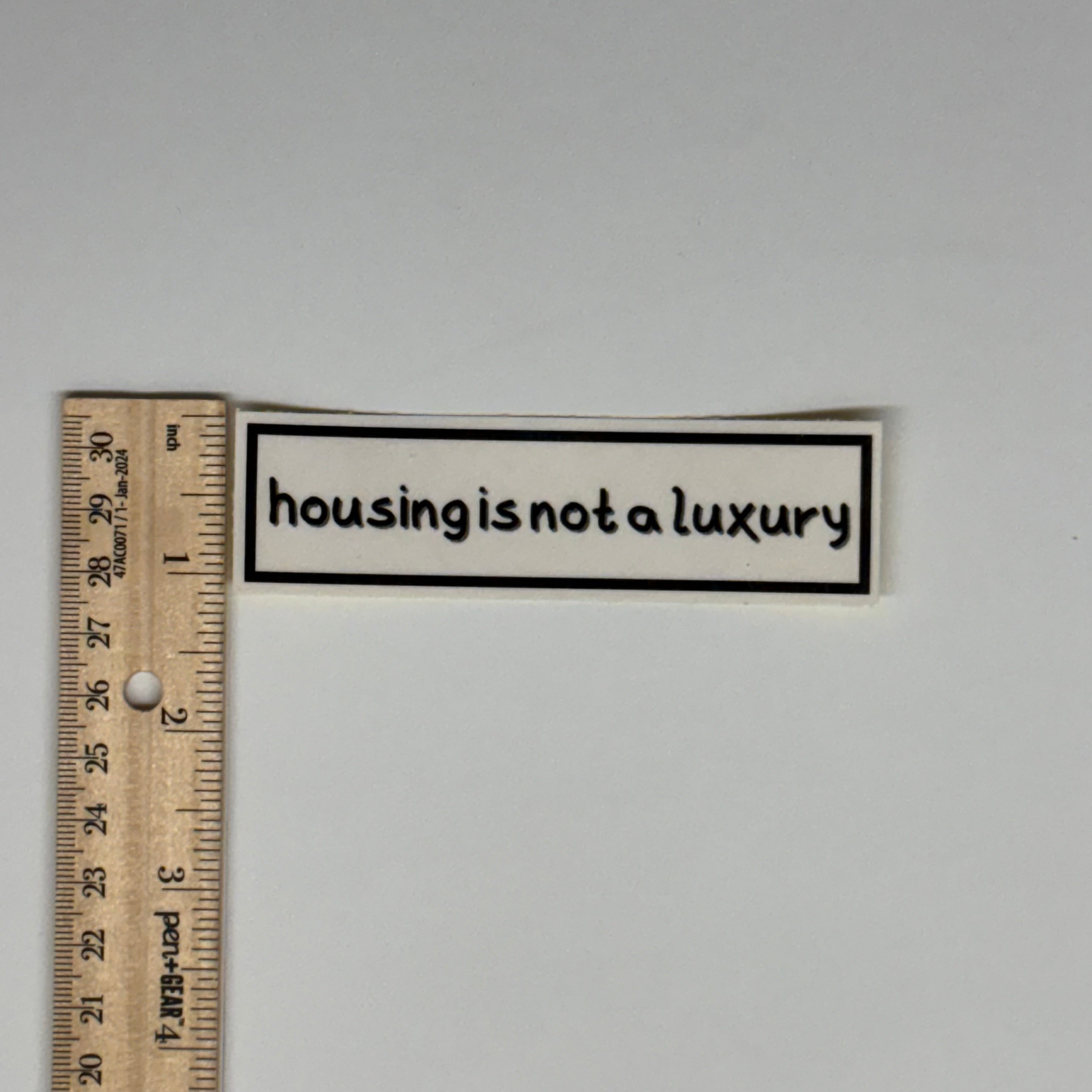 housing is not a luxury sticker