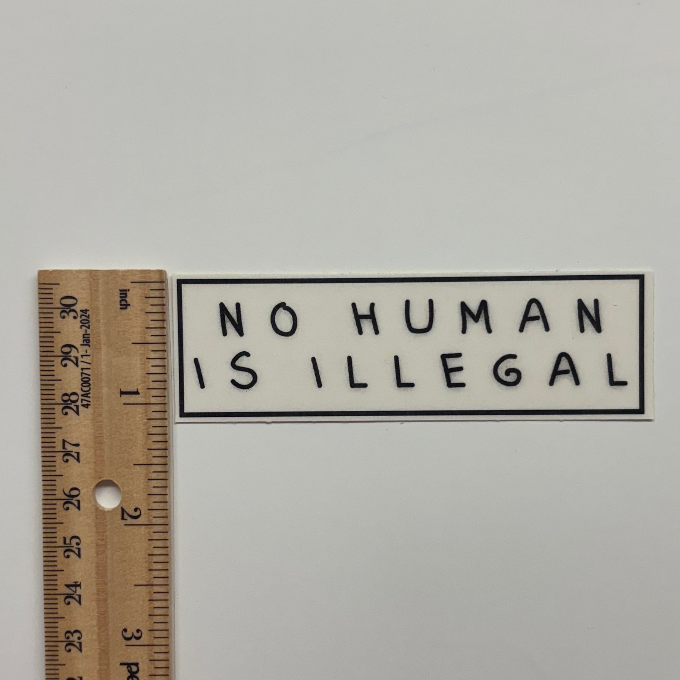 no human is illegal sticker