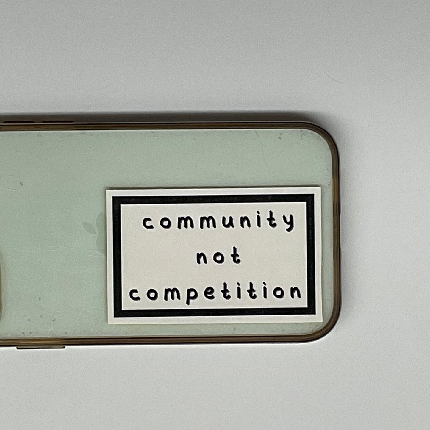 community not competition sticker