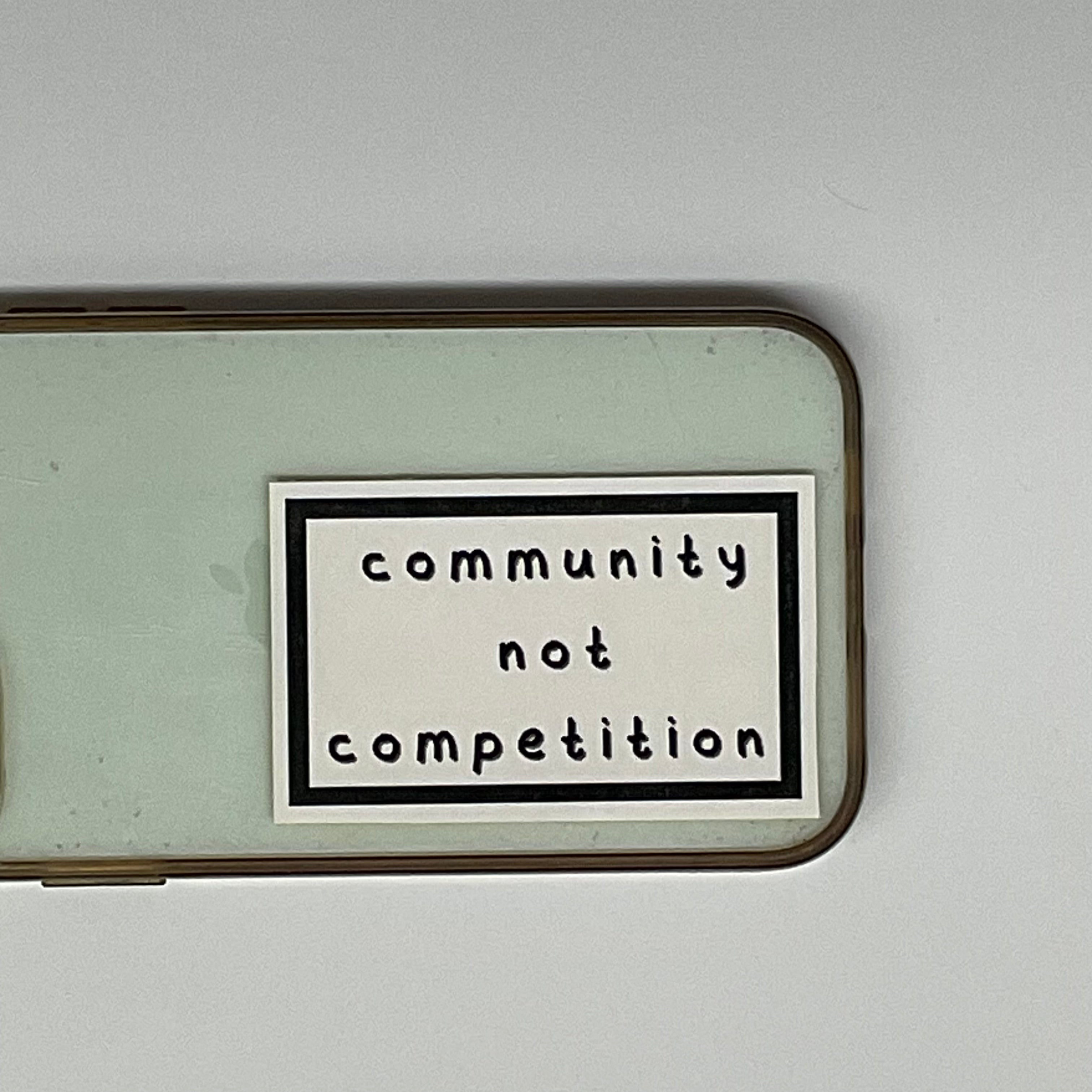community not competition sticker